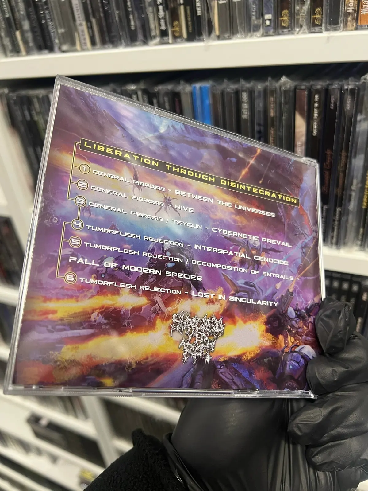 Задняя сторона CD Liberation Through Disintegration с шестью треками